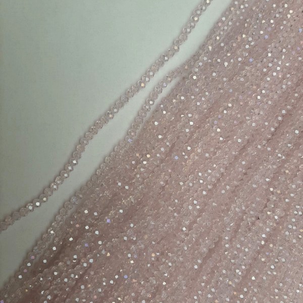 Beads Czech Crystal Pink Transparent Faceted Rondelle with a Gasoline Tint, Diameter 3.5×3 mm ±, Length 39 mm ± on a Thread