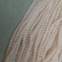 Beads Czech Crystal Light Pink Faceted Rondelle, diameter 6x5 mm, length 43 mm on beading thread