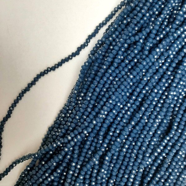 Beads Czech Crystal Dark Azure Faceted Rondelle, diameter 3×2.5 mm, length 39 mm on beading thread