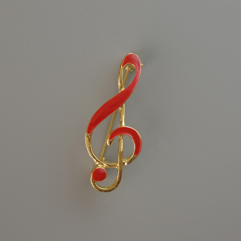 Brooch 'Treble Clef' red enamel, gold-tone metal 38x16 mm