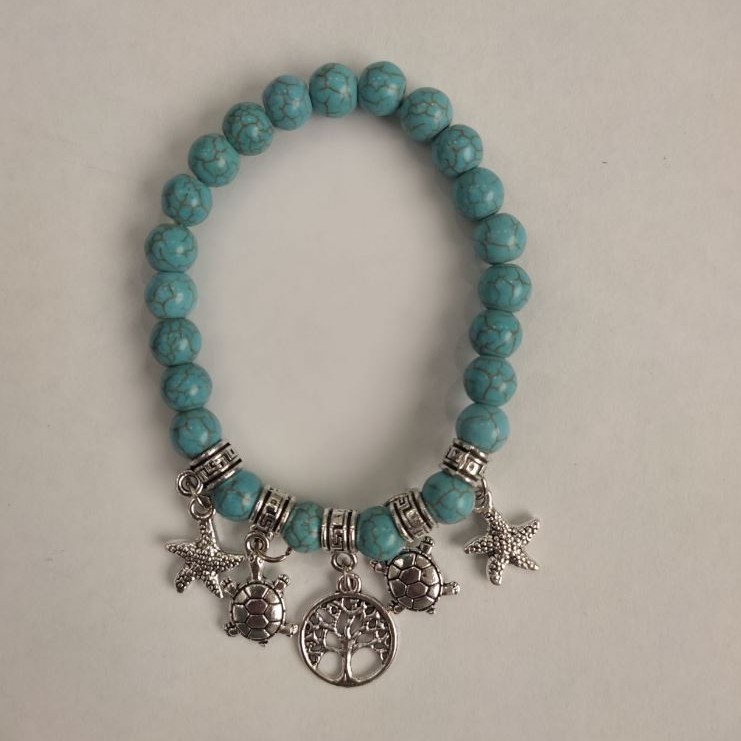 Turquoise Bracelet (synthetic) smooth beads, 8 mm diameter ± with silver inserts, length 18 cm ± (stretch)