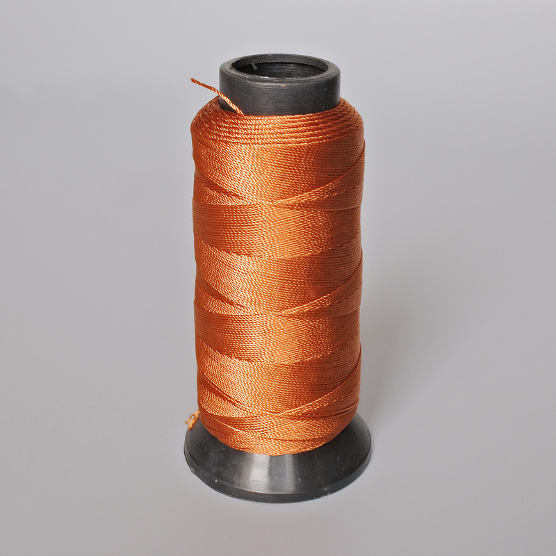 Orange bobbin thread, diameter 0.9 mm, nylon for crafts 500 m