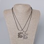 Paired pendants 'Dragon' black enamel and silver metal 33x26mm, length 45-50 cm
