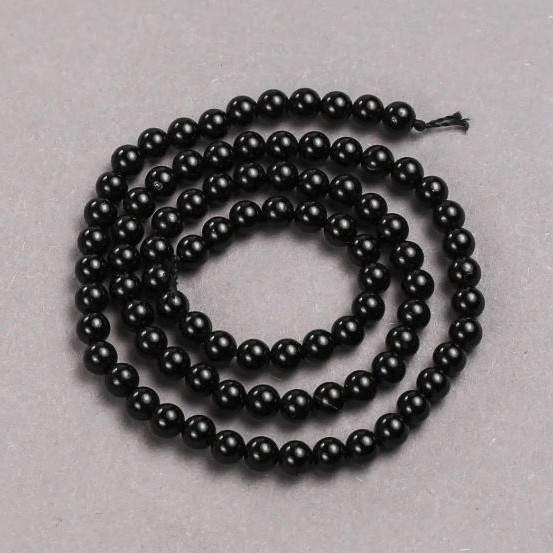 Beads on a cord of natural stone — Black Tourmaline, smooth round beads, diameter 4–5 mm, length 39 cm