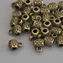 Bronze-colored bail hardware, dimensions 8.5×6 mm ±, hole diameters 2.8 mm ± and 1.8 mm ±; packaging 20 g (~28 pcs)