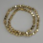 Hematite beads, gold-colored cube with through hole 4x4 mm +/- on a beading thread, length 38 cm+