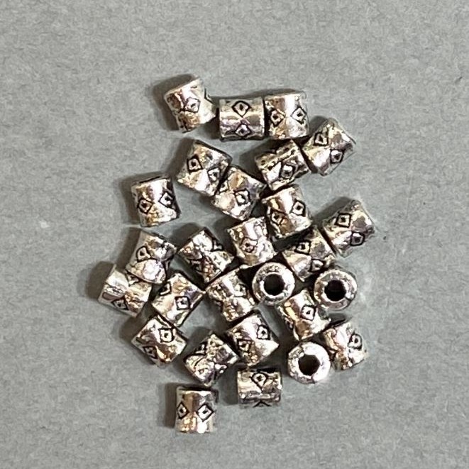 Bead insert findings in silver metal color, 4x3 mm diameter with a 2 mm hole, packaging 20 g (approx. 110 pcs)