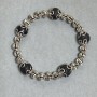 Bracelet with smooth lava beads, 10 mm diameter ±, with metal inserts, length 18 cm ±, stretch