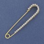 Brooch pin with white pearls 70x16 mm +/- gold-tone metal