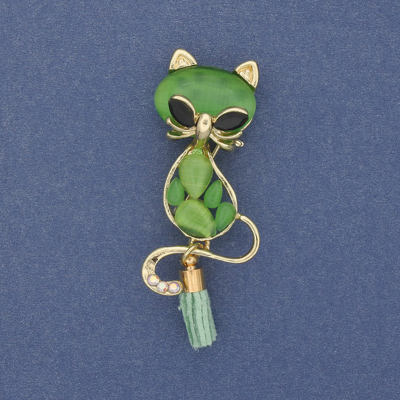 Brooch-pendant 'Cat with a Bone', green cat's-eye on golden metal 43x17 mm+