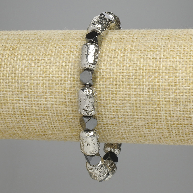 Lava Cylinder Bracelet, Light Silver 12x8 mm ±, Hematite Faceted 5.5x6 mm ±, Length 18 cm ±, Stretch