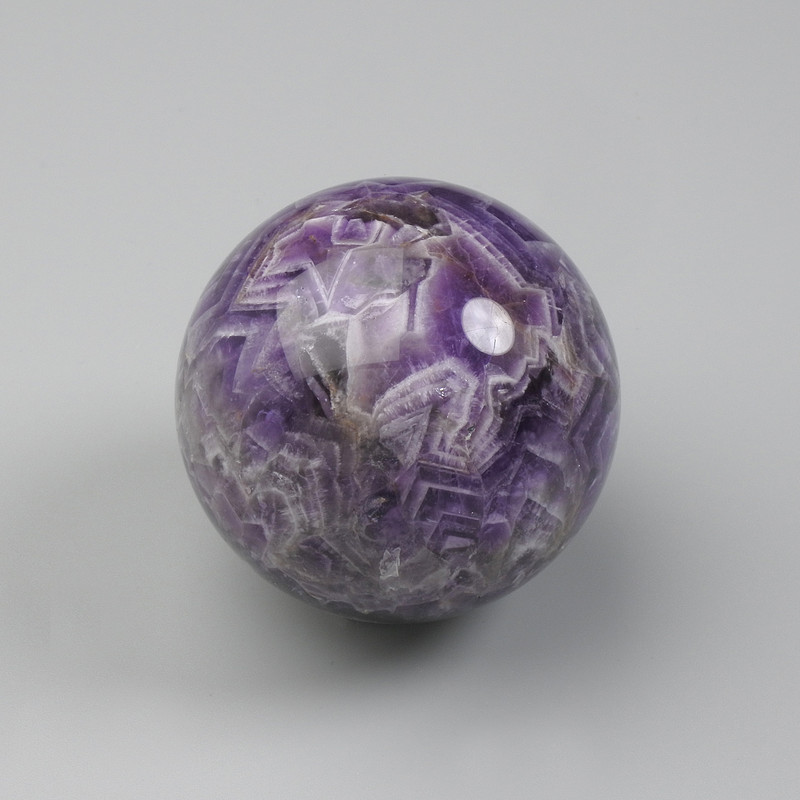 Souvenir sphere of natural amethyst, diameter from 45–60 mm ± assorted sizes (Price per 100 g) weight from 150 g