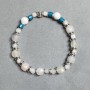 Bracelet with Howlite beads 8mm +/- and Rock Crystal faceted cubes 4mm +/- and 7mm +/- with inserts, length 18 cm +/- stretch