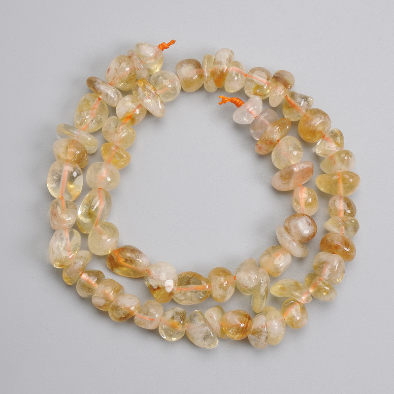 Citrine beads, tumbled, 8-14×4-10.5 mm, 39 cm long on thread