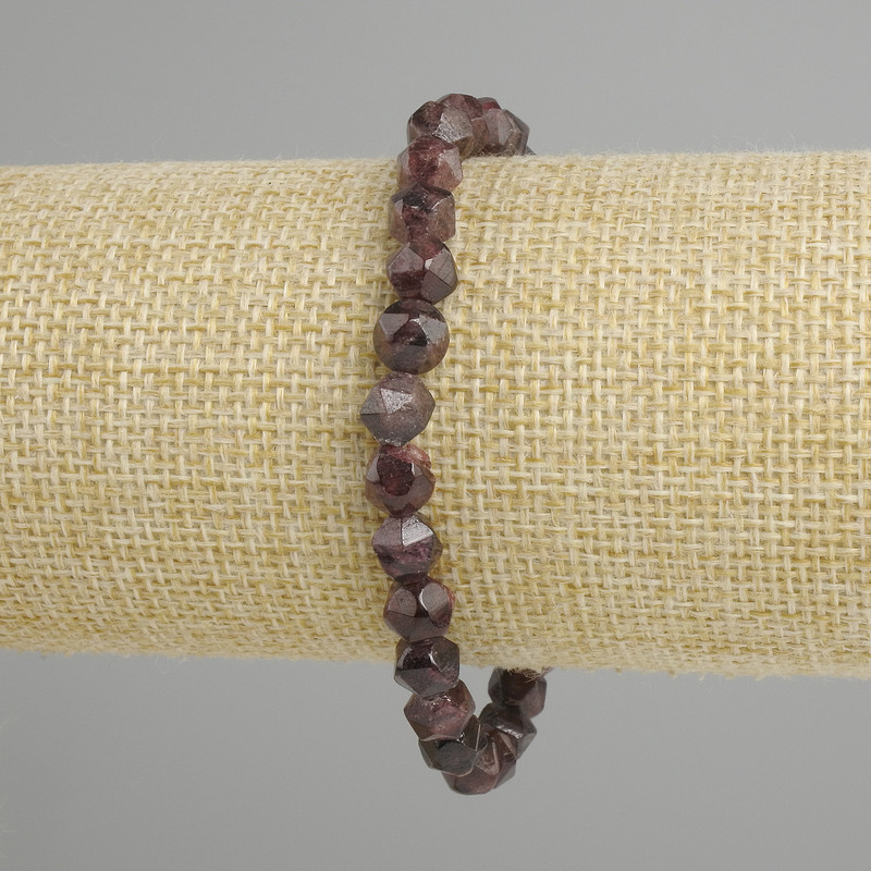 Garnet bracelet with pressed multifaceted beads, approximately 6x6 mm diameter, 5 mm ±, length 18 cm ± on stretch cord