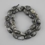 Larvikite beads, tumbled, diameter 13–16×10–12.5 mm, 5 mm ±, length 39 cm ±, on thread