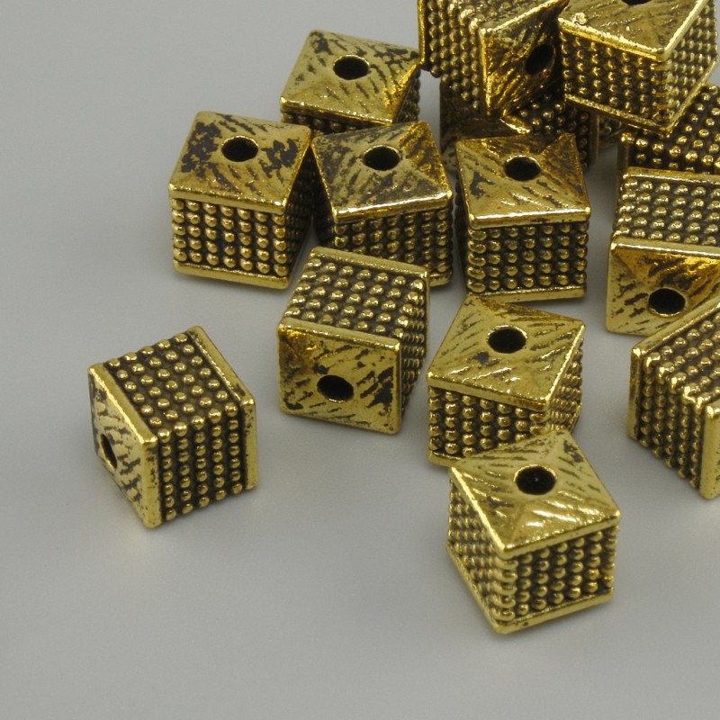 Cube-shaped bead insert, yellow gold color, 6x6 mm, hole diameter ~2 mm, packaging 20 g (~15 pcs)
