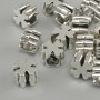 Cross-shaped bead insert, silver-colored metal, 9x9 mm, hole diameter ~4.9 mm, packaging 20 g (~15 pcs)