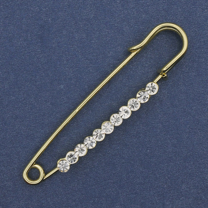 Brooch pin with white rhinestones 60×12 mm ± gold-tone metal