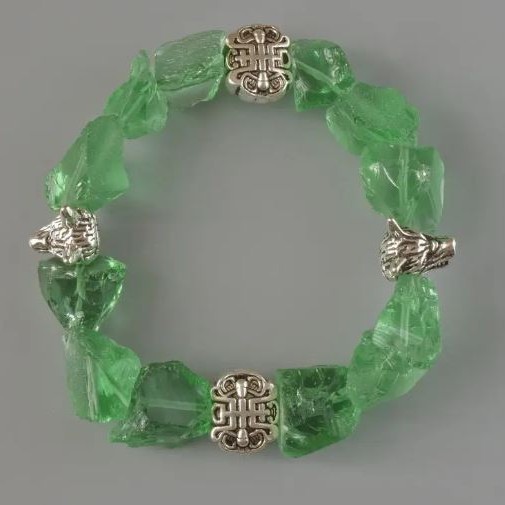 Bracelet Quartz toned green unpolished stone faceted, diameter 10x13mm+ -, length 18cm + - (stretch) with metal inserts