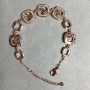 Gold-tone metal bracelet with white rhinestones, 12 mm diameter, 16 mm length, and a 3 cm extender chain