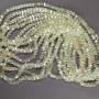 Crystal beads in Swarovski style, yellow transparent, faceted ball with petrol coating, diameter 5x4 mm, thread length 48 cm