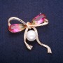 Sale! Bow Brooch with central bead and yellow-pink crystals in Swarovski-style, gold-tone metal 45×47 mm