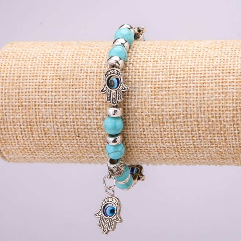 Turquoise amulet bracelet (artificial) with blue 'little eyes' on an elastic cord, diameter 12 (+- ) mm, length 18 cm with inserts and a pendant