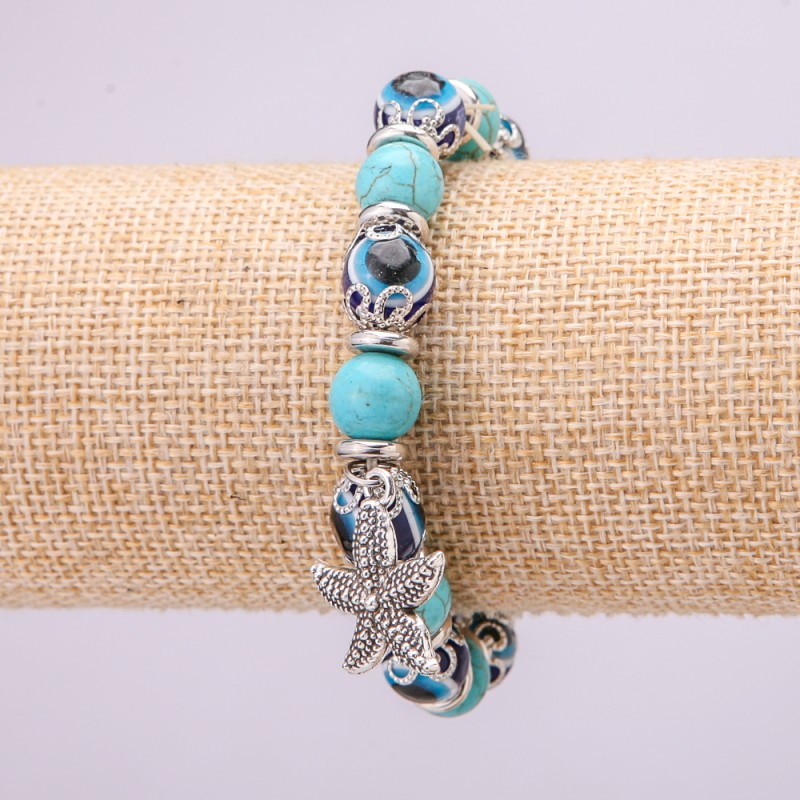Turquoise Obereg Bracelet (synthetic) with blue Eyes on elastic, diameter 10(+-)mm, length 18 cm with inserts and Starfish pendant
