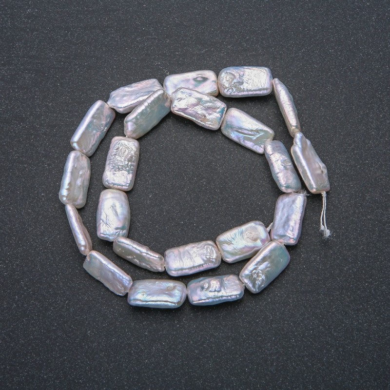 Thread of natural Baroque pearls, diameter 18x10 mm, length 39 cm +/- with gasoline iridescence