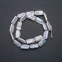 Thread of natural Baroque pearls, diameter 18x10 mm, length 39 cm +/- with gasoline iridescence