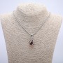 Pendant 'Ball in Paw' 35x17 mm on a chain, length 70 cm, silver-colored metal