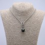 Pendant 'Paw with Sphere' 45x20 mm on a chain, length 70 cm, silver-colored metal