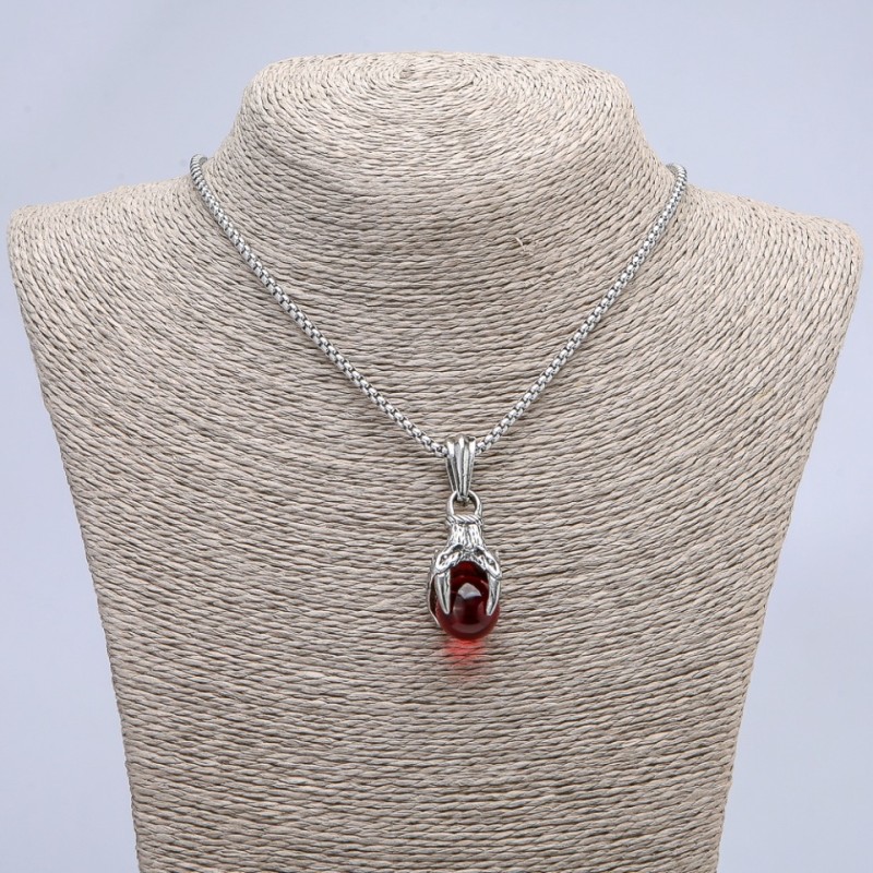 Pendant 'Paw with Sphere' 45x20 mm on a chain, length about 70 cm; silvery metal