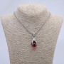 Pendant 'Paw with Sphere' 45x20 mm on a chain, length about 70 cm; silvery metal