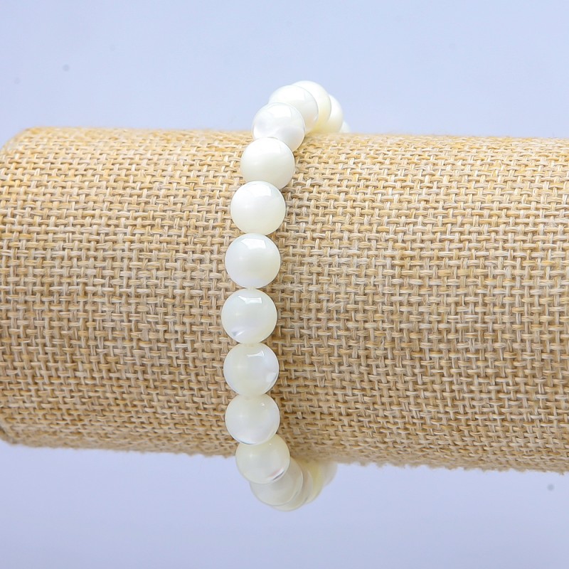 Elastic bracelet with white mother-of-pearl, smooth bead, 9 mm diameter, 18 cm length