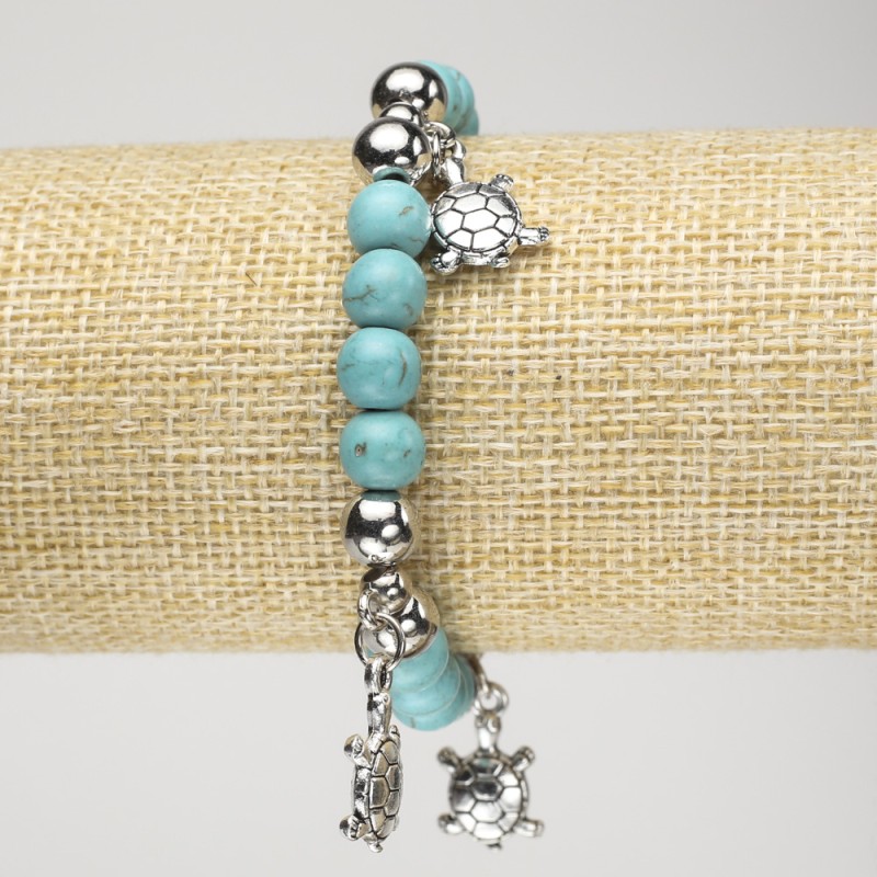 Turquoise bracelet (artificial) on elastic, 8 mm diameter +/- with silver inserts and turtle shapes, length 18 cm+