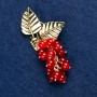 Brooch with natural carnelian 'Branch with berries', gold-tone metal 60x35mm