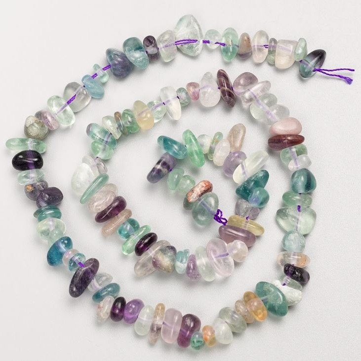 Beads on a string of natural fluorite, tumbled, 8x4 mm, 40 cm long