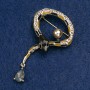 Snake Brooch with black and brown enamel, crystal, bead, and golden rhinestones, gold-tone metal 35×64 mm