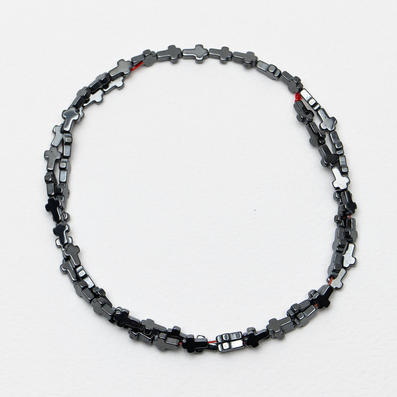 Hematite cross-shaped beads, 4x6x2 mm, approx. 40 cm on beading thread