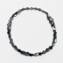 Hematite cross-shaped beads, 4x6x2 mm, approx. 40 cm on beading thread