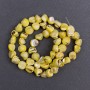 Beads tinted yellow mother-of-pearl, faceted, 8x6 mm, 41 cm on thread