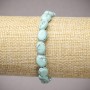 Elastic bracelet with turquoise (synthetic) oval beads, diameter 10x8mm +/-, length 18cm +/-