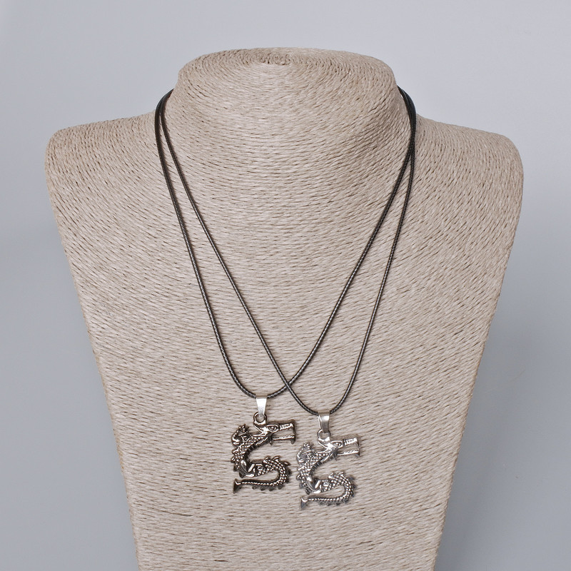 Paired pendants 'Dragon' black enamel and silver metal 33x26mm, length 45-50 cm