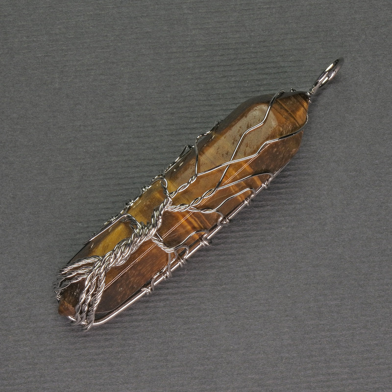 Pendant Tiger's Eye Hexagonal Crystal 12x50x57mm ± in a Silver-Plated Weave