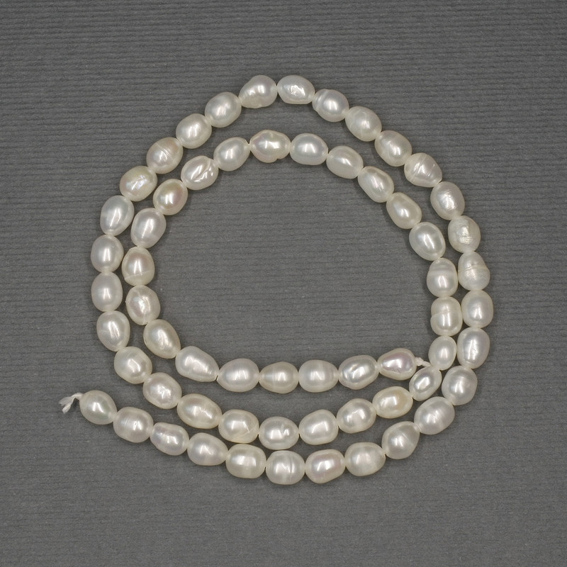 River white oval pearls on a thread, diameter 6 x 4.5-5 mm, length 36 cm+