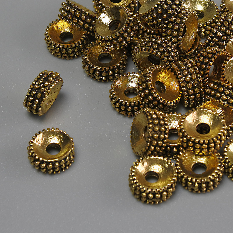 Bead-insert, dark gold color, diameter 7.5×3.5 mm, hole diameter 2.3 mm, packaging 20 g (~35 pcs)