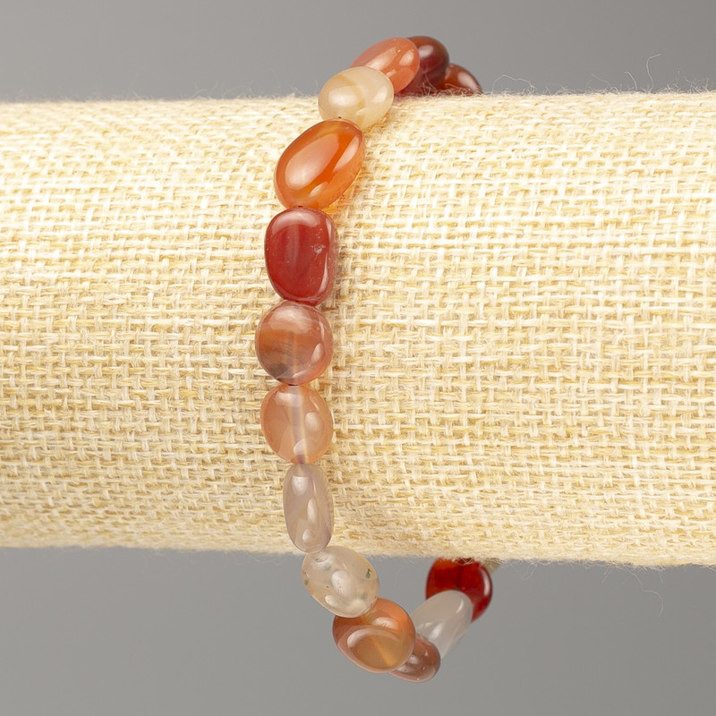Bracelet of natural carnelian, faceted beads on elastic, diameter 11x8 mm +/-, length 18 cm
