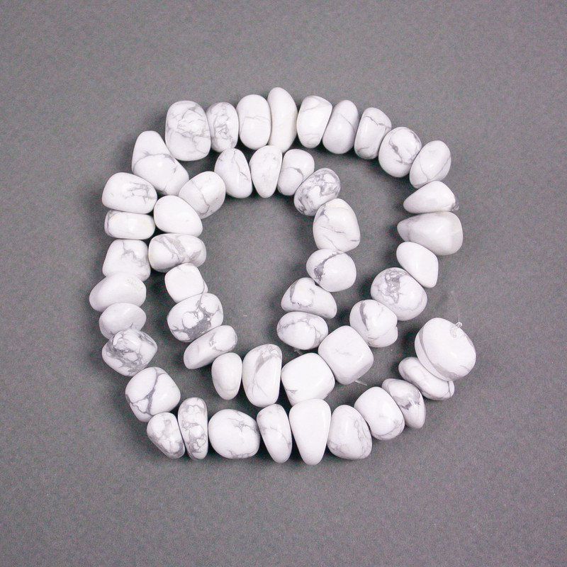 Howlite beads on thread, natural stone, faceted, assorted sizes, diameters 14x10-11x8 mm, length 39 cm